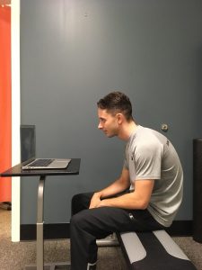 Person sitting with slouched posture