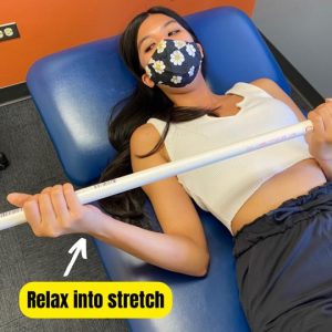 External rotation stretch with a dowel