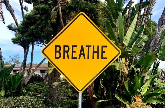 Yellow breathe road sign