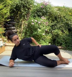 Woman doing clamshell exercise