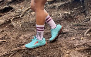 Woman's ankle while hiking on roots