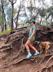 Woman leaning back while walking or hiking in Hawaii