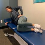 Physical therapist demonstrating clam exercise