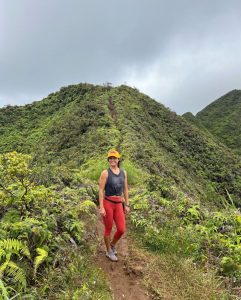 Girl hiking a steep trail in hawaii