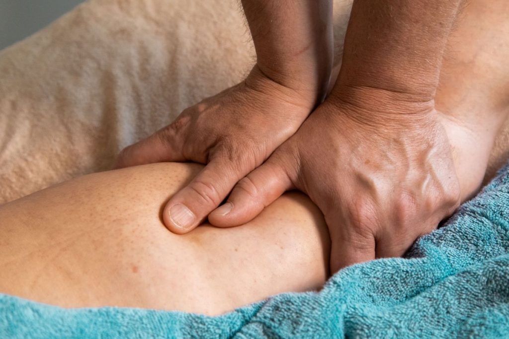 Person performing manual therapy on the calf